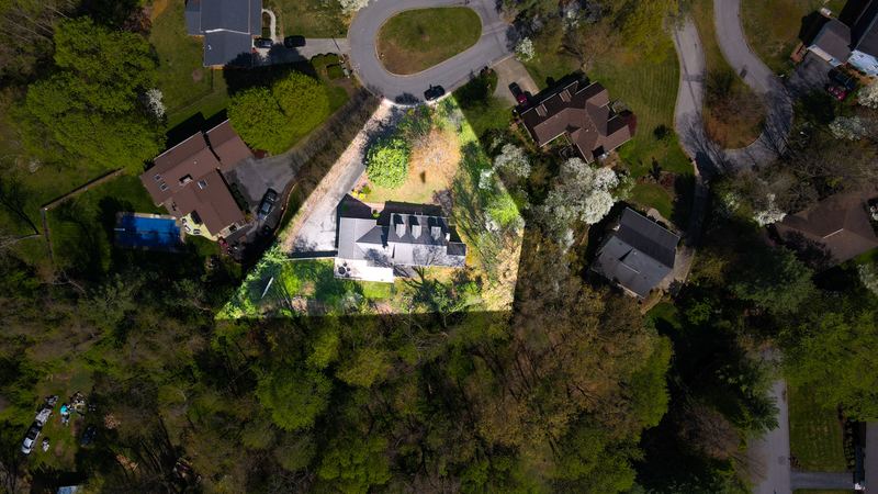Top-down drone shot with the property lot outlined
