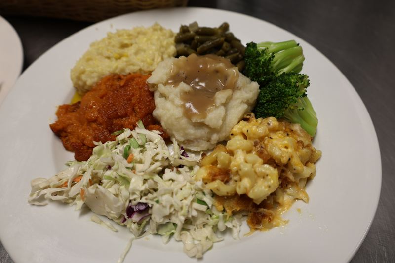 Plated meal with fried chicken, mashed potatoes, and green beans